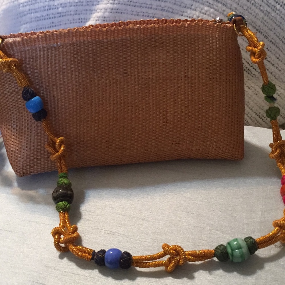 New  Hancrafted woven handbag with beaded handle.